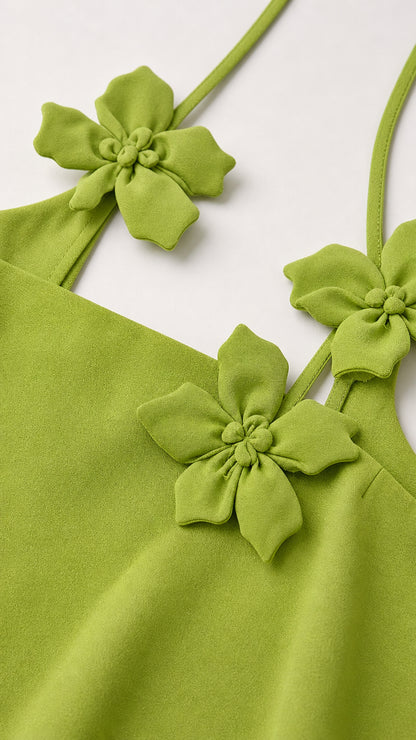 Close up of floral appliques and straps on tank top