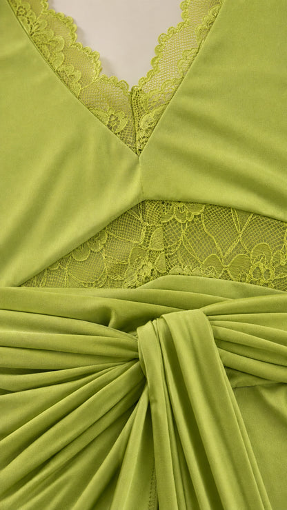 Close-up detail of lace trim and front knot on lime green dress