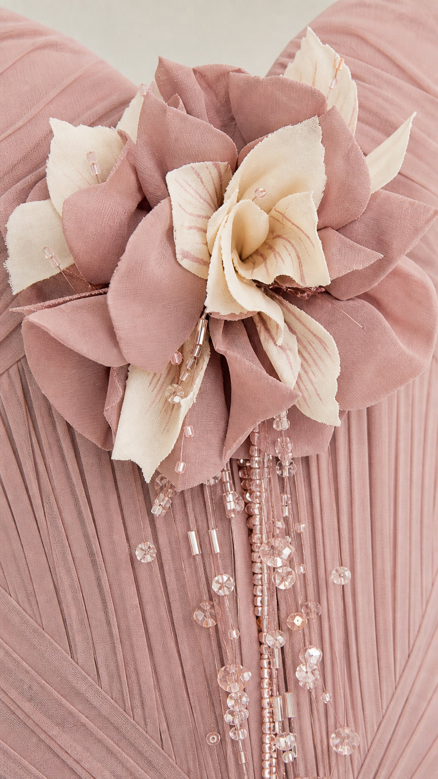 Close up of floral applique and beading detail on bodice