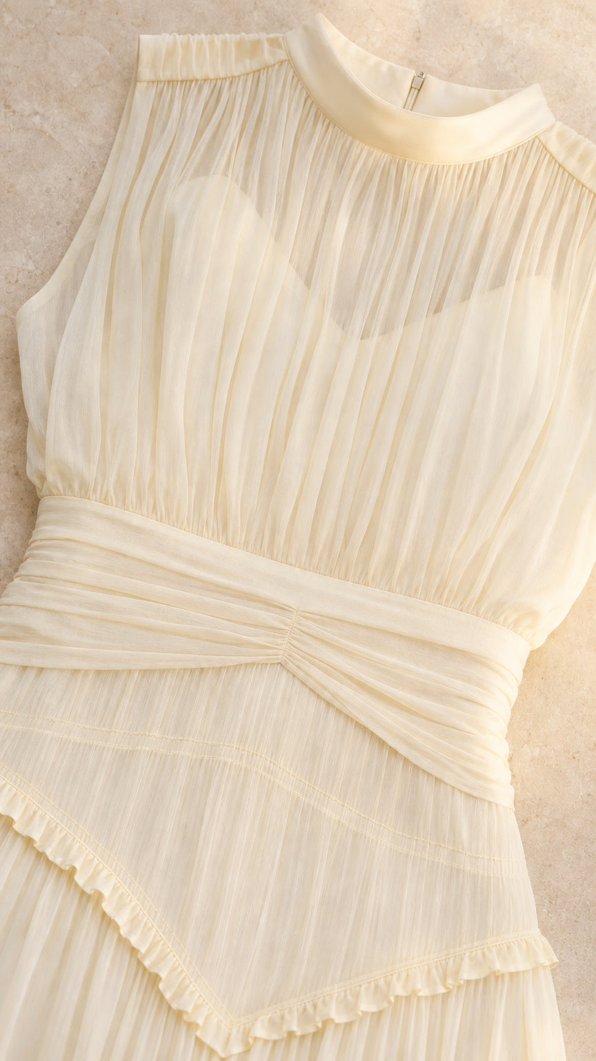Close-up detail of illusion pleated high neck, sweetheart bust, and ruched waist