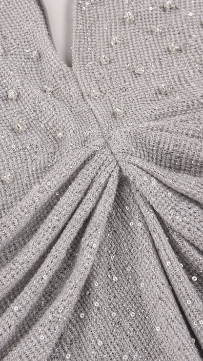 Close-up detail of beaded and sequined bodice texture