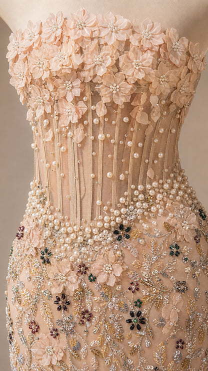 Close-up detail of structured bodice with 3D flowers, pearls, and beadwork