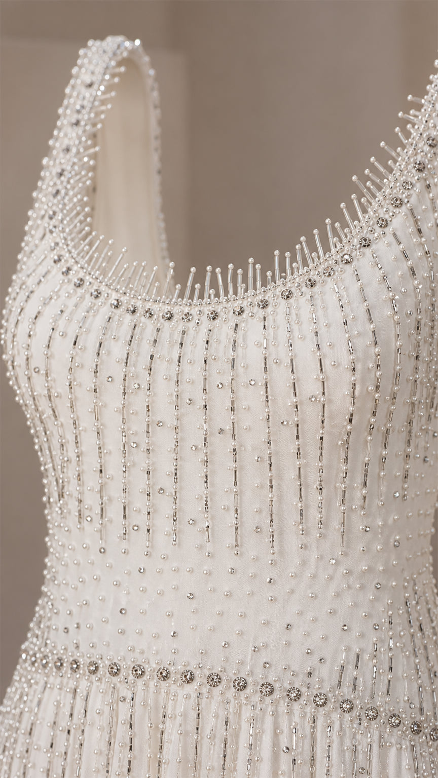 Close-up detail of beaded scoop neckline