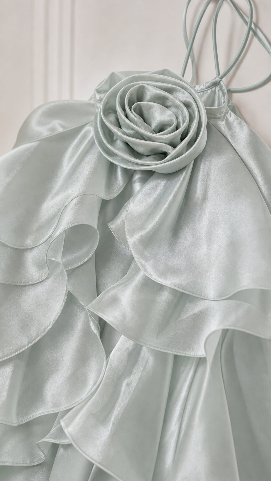 Close-up detail of the 3d fabric rosette and cascading ruffles