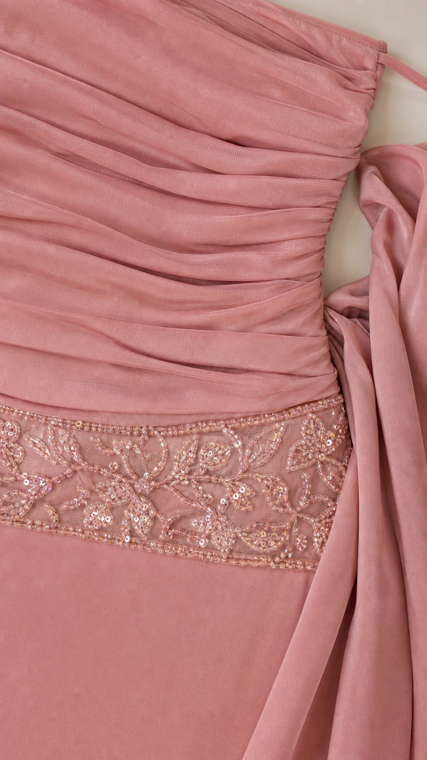 Close-up of ruched bodice and sequin embellished waist detail