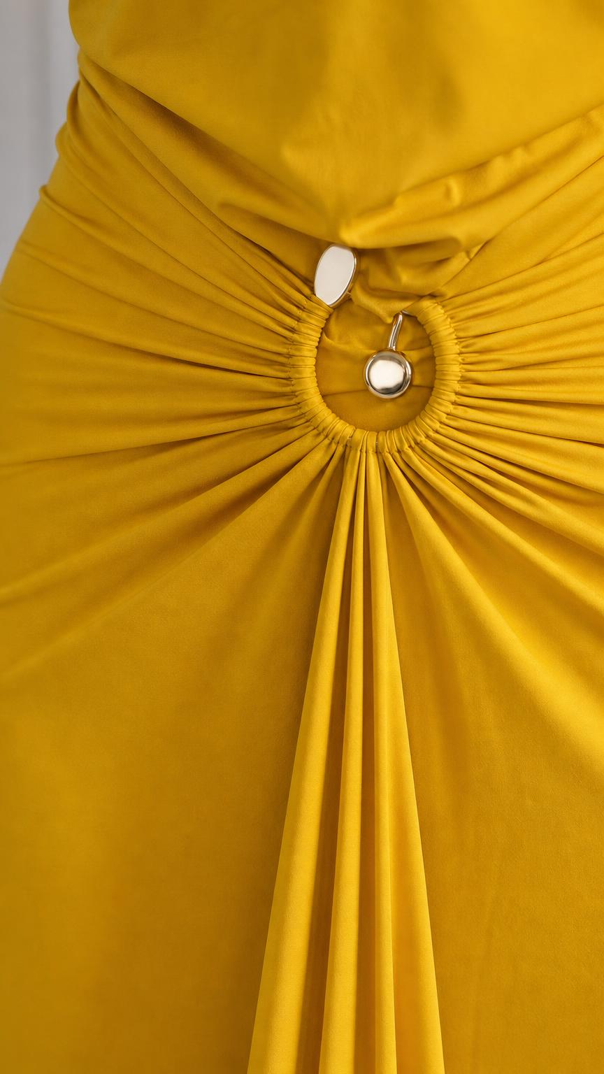 Close-up detail of the O-ring hardware and waist ruching on yellow dress