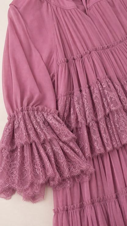 Close-up detail of sleeve and tiered lace ruffles