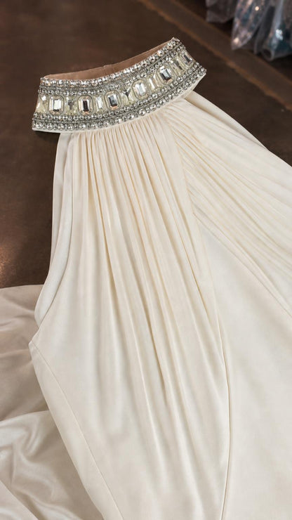 Close-up of crystal embellished high neckline collar