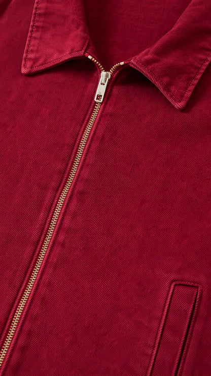 Close-up of red denim jacket collar and zipper detail