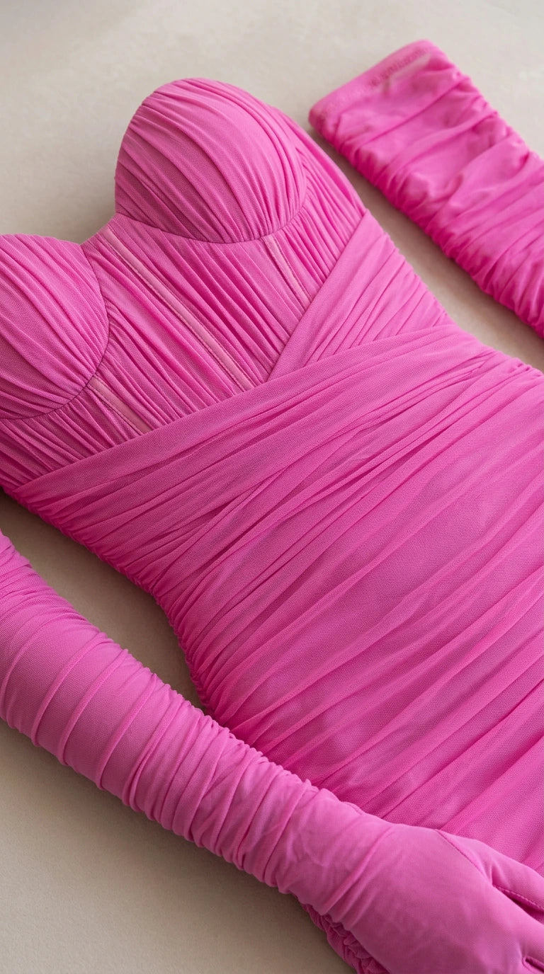 Detailed close-up of hot pink ruched sweetheart bustier and gloves