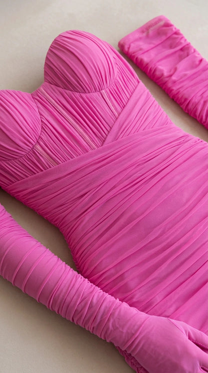 Detailed close-up of hot pink ruched sweetheart bustier and gloves