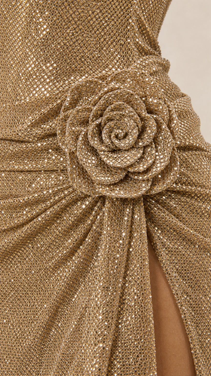Close-up detail of 3D fabric rose accent and textured gold fabric
