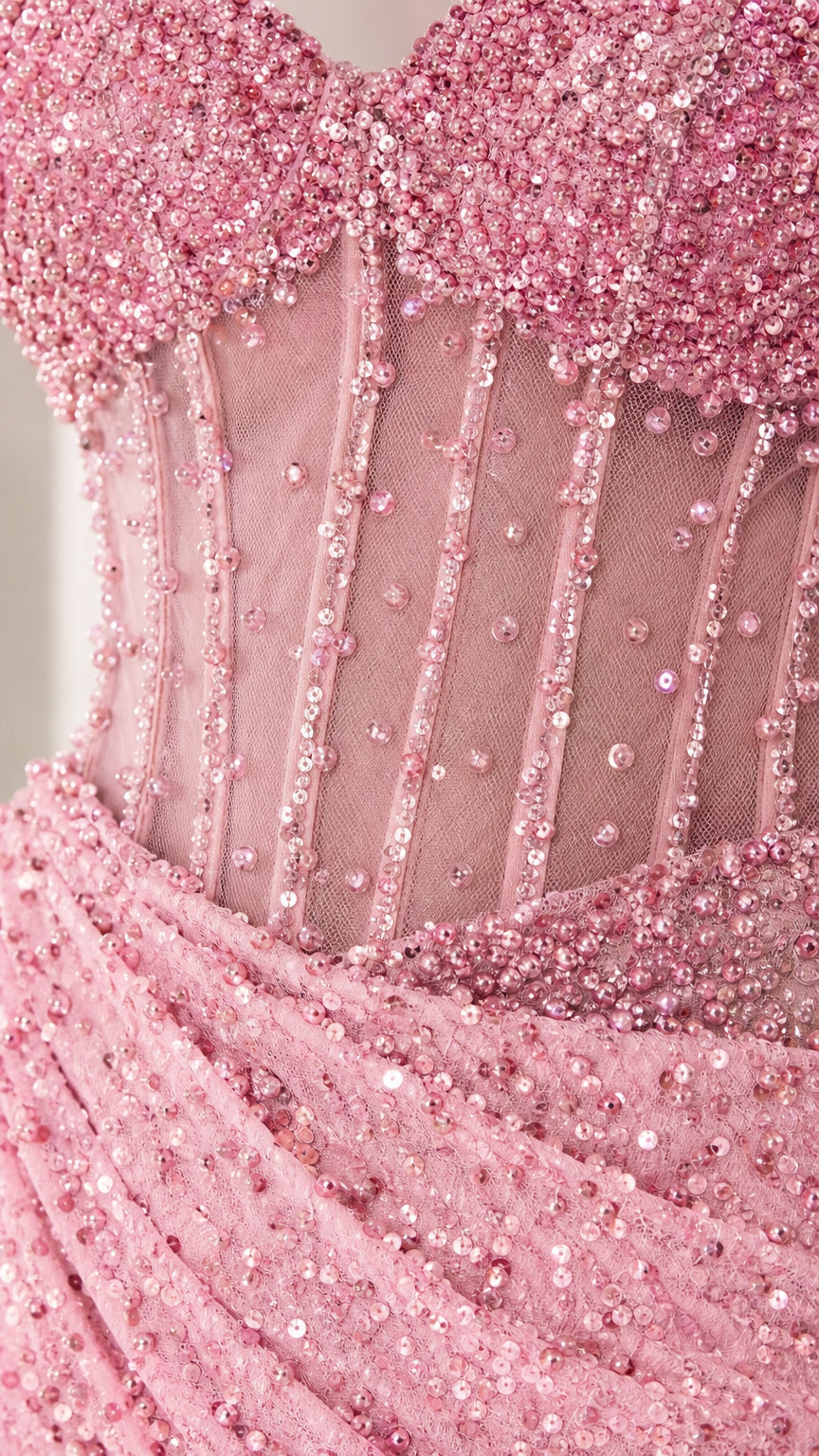 Close-up detail of embellished corset bodice and sequins