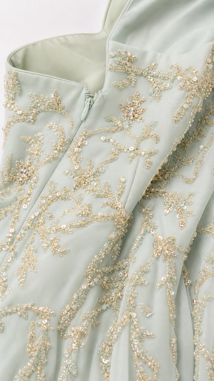 Close-up of bodice embroidery and zipper detail