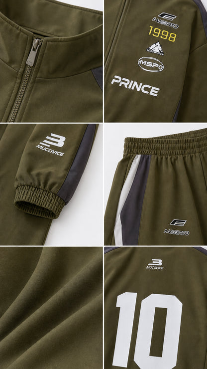 Close-up details of olive green tracksuit zipper, prints, elastic waistband, and cuffs