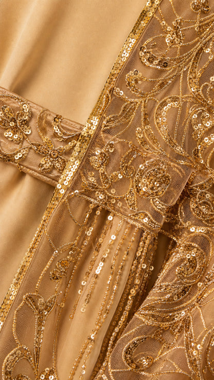 Close up detail of gold sequin embroidery and waist belt
