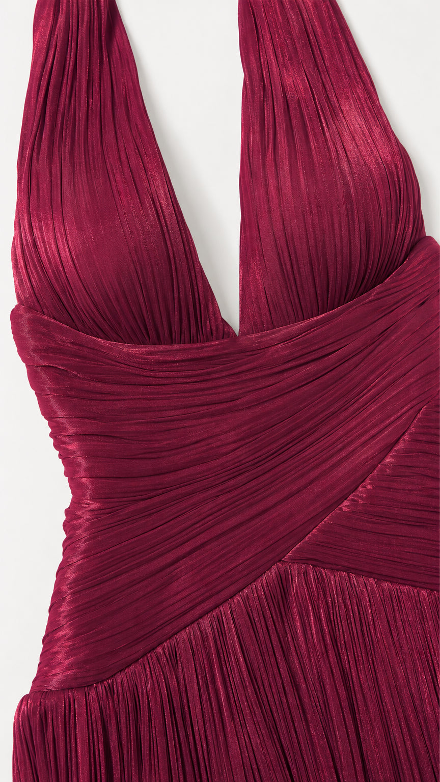 Close-up detail of burgundy plunging halter neckline and cross-ruched waist