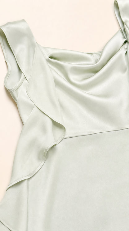 Close-up of cowl neck and ruffle strap detail on sage green dress