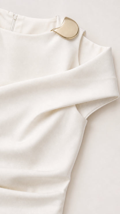 Close-up detail of asymmetrical neckline with gold-tone metal hardware accent