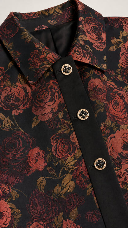 Close-up detail of jacket collar, contrast placket, and metallic buttons