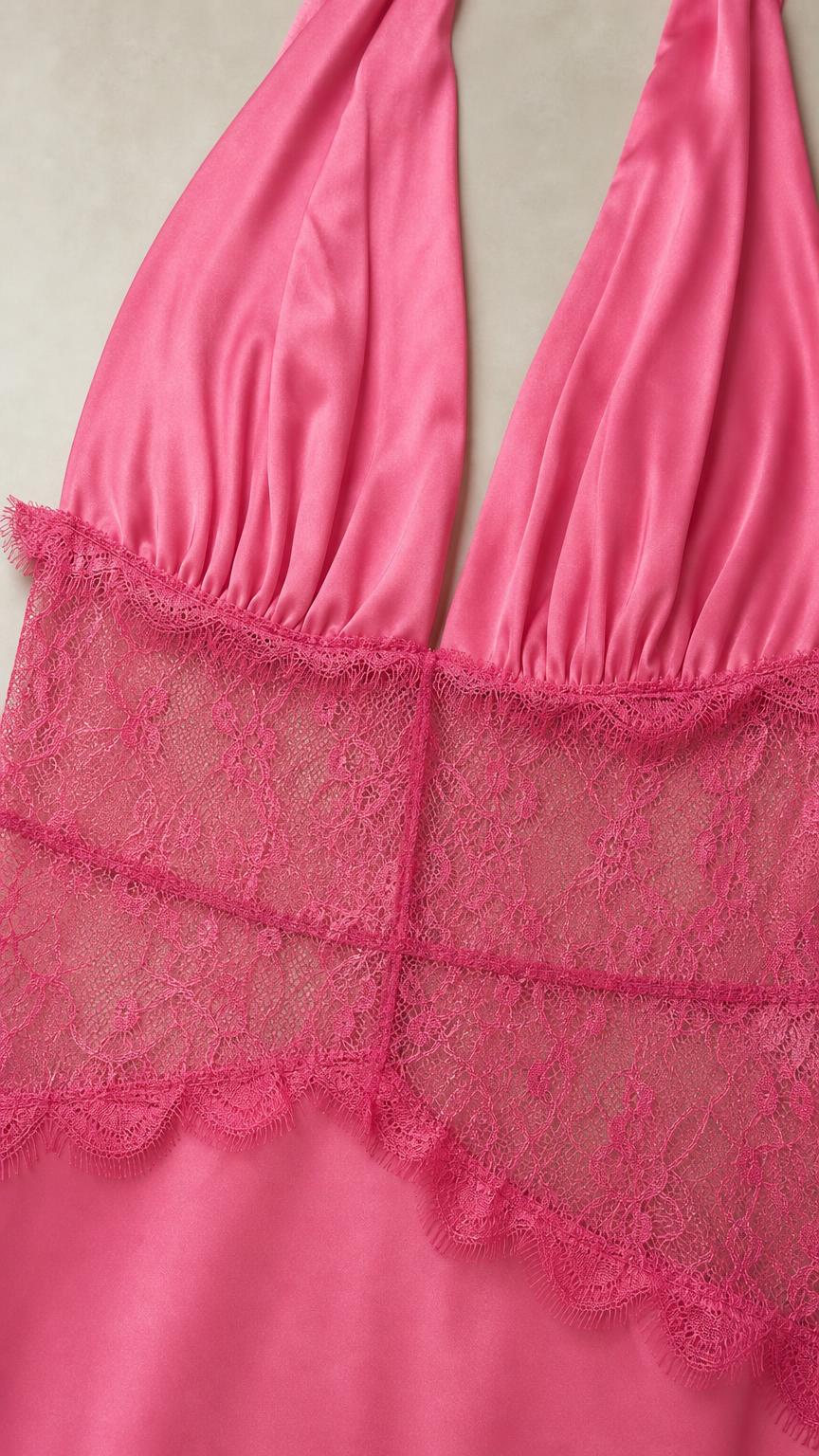 Close-up detail of lace bodice and halter neck on pink dress