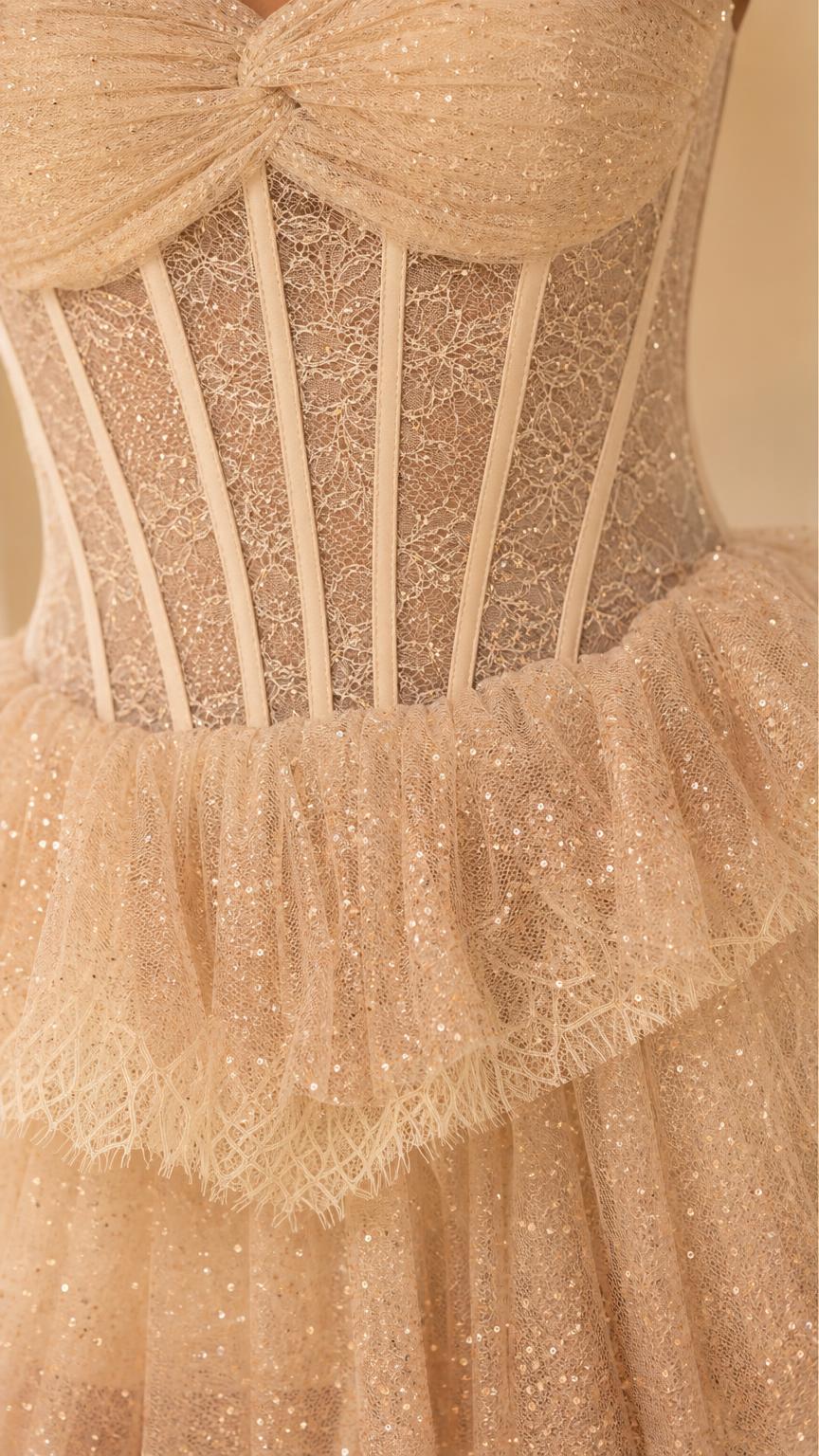 Close-up detail of structured boning and sequin tulle on champagne dress