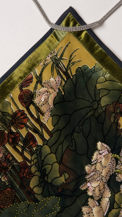 Close-up detail of the crystal trim and printed velvet fabric