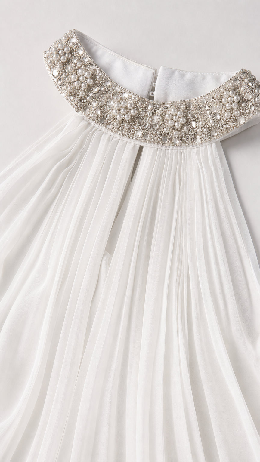 Close up of crystal and pearl embellished collar and pleated bodice