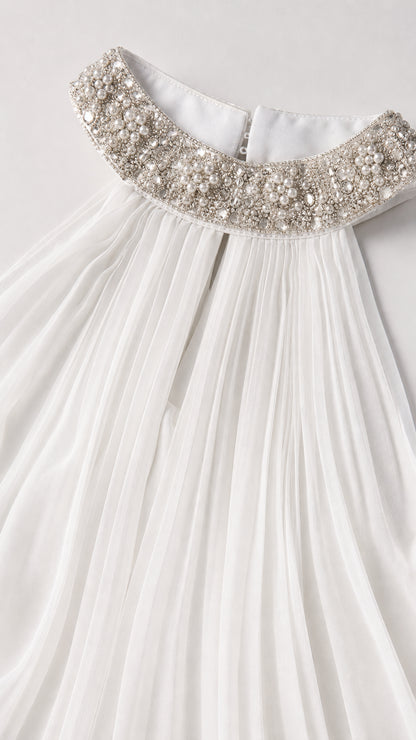 Close up of crystal and pearl embellished collar and pleated bodice