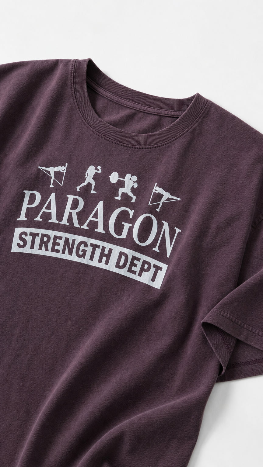 Close-up of chest graphic on Washed Plum t-shirt reading Paragon Strength Dept