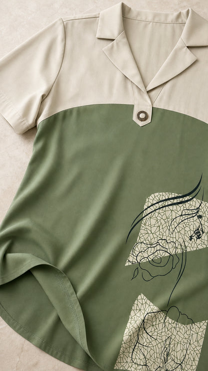 Close-up of lapel collar and graphic print detail on green dress