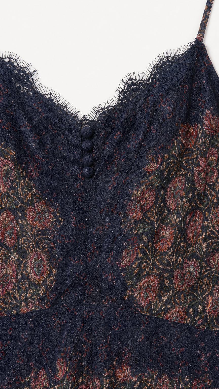 Close-up of lace neckline and button details on Navy slip dress