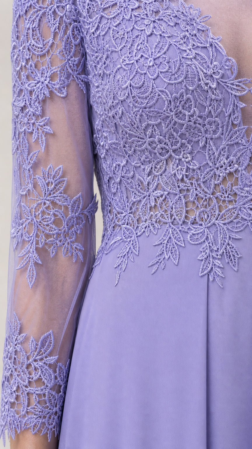 Close-up detail of the floral lace bodice and sheer sleeves