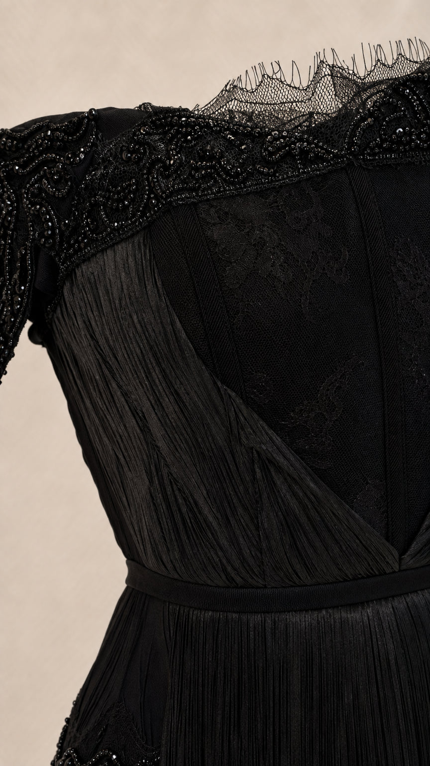Close-up detail of beaded lace neckline and bodice texture
