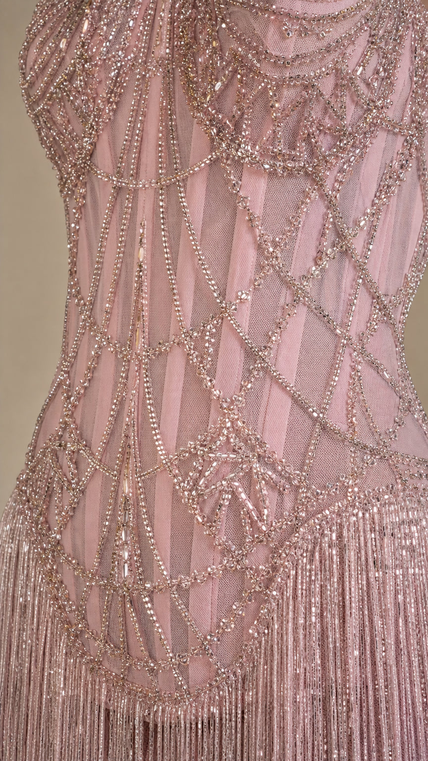 Close up detail of intricate crystal beadwork on bodice and fringe
