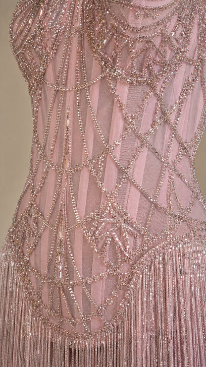 Close up detail of intricate crystal beadwork on bodice and fringe