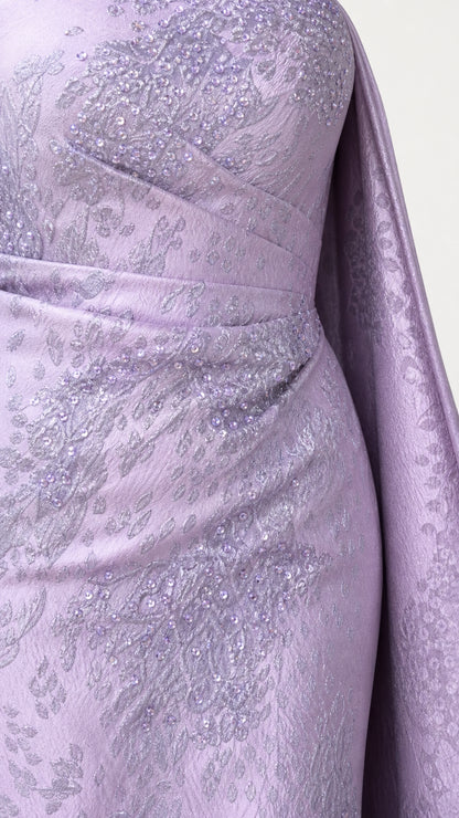 Close-up detail of textured fabric and ruched bodice