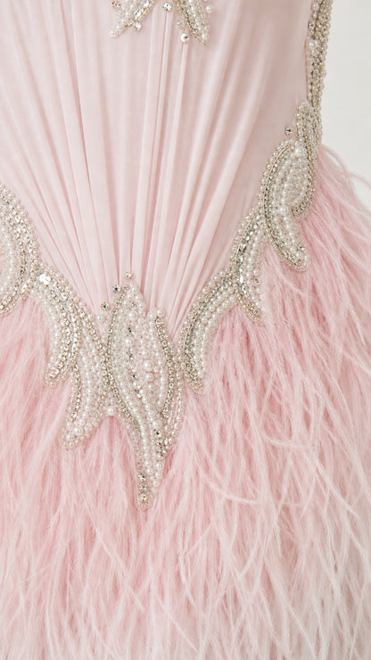 Close-up of beaded waist embroidery and soft feather skirt detailing