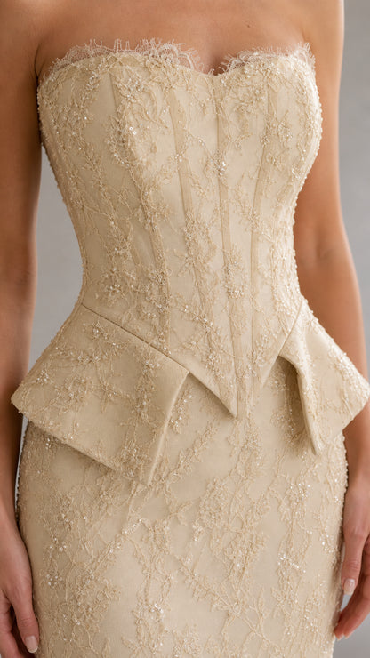 Close-up detail of structured boned corset bodice and peplum waist detail in champagne lace