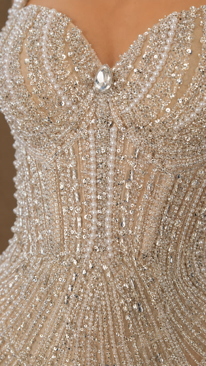 Close-up detail of beaded bodice and crystal accent