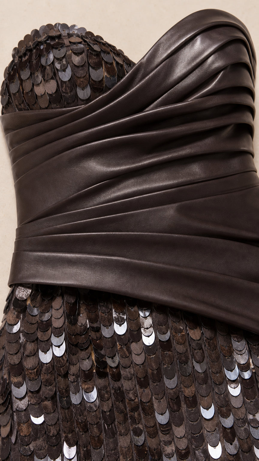 Close-up detail of draped ruched bodice and shimmering sequin paillettes