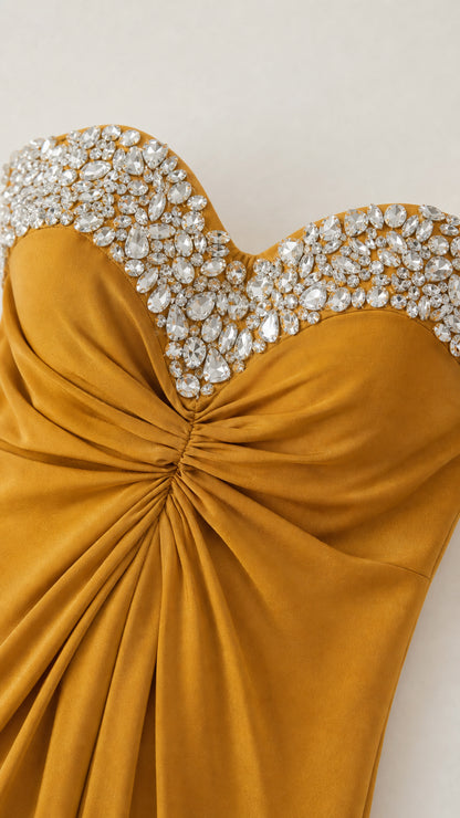 Close-up detail of crystal rhinestone sweetheart neckline and ruched bodice