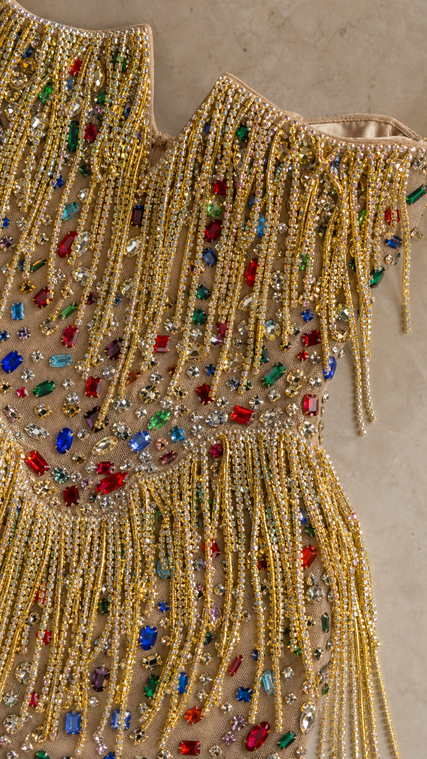 Close-up of multicolored gemstone and fringe detailing