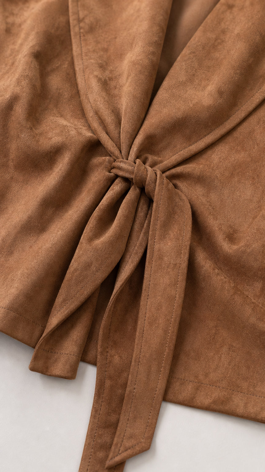 Close-up detail of front tie knot and soft faux suede fabric texture in Camel