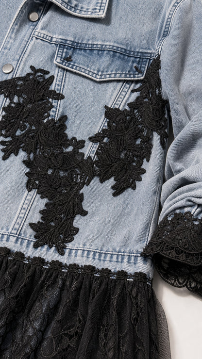 Close-up detail of chest and hem black lace appliques on blue denim jacket