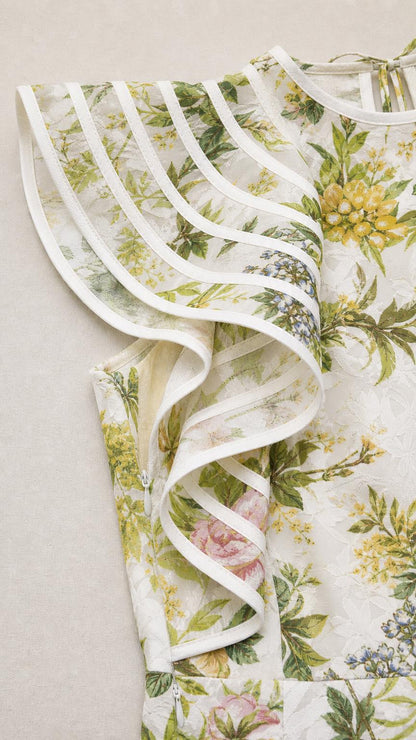Close-up detail of shoulder ruffles and fabric texture