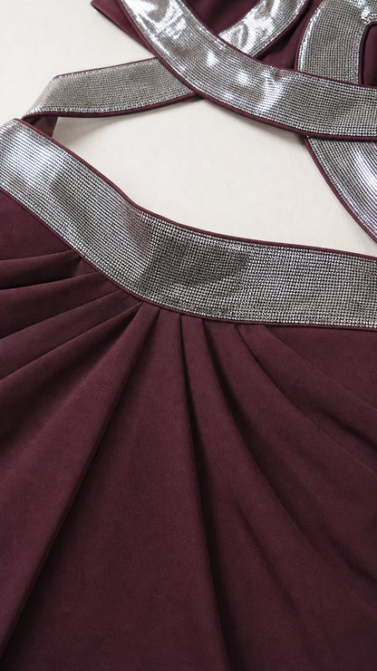 Close up of shimmering silver strap and ruched waistband detail