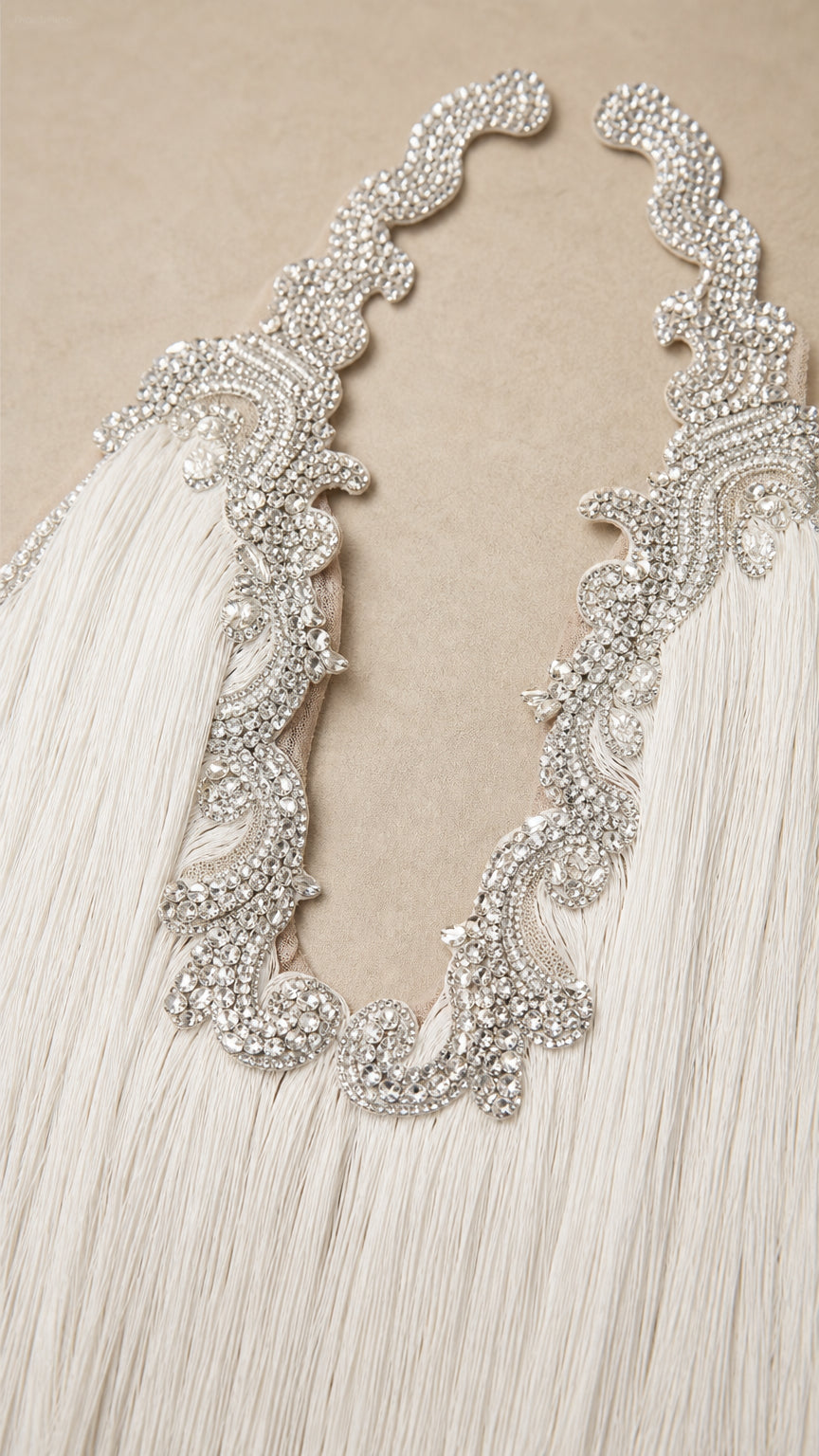 Close-up detail of crystal and rhinestone embellished neckline