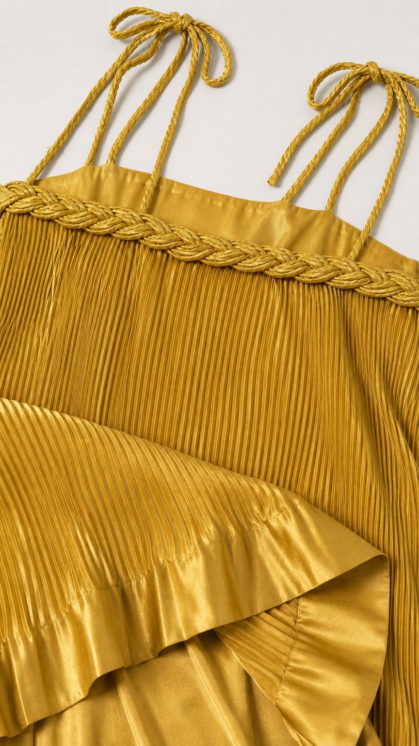 Close-up detail of self-tie straps and braided neckline