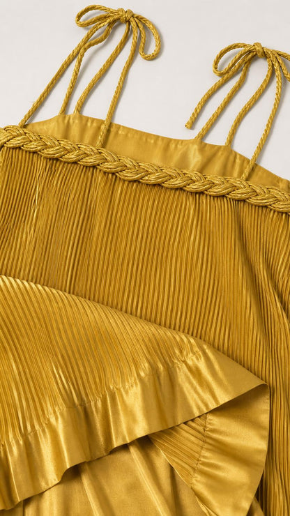 Close-up detail of self-tie straps and braided neckline